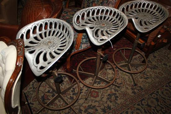 Three tractor seat stools